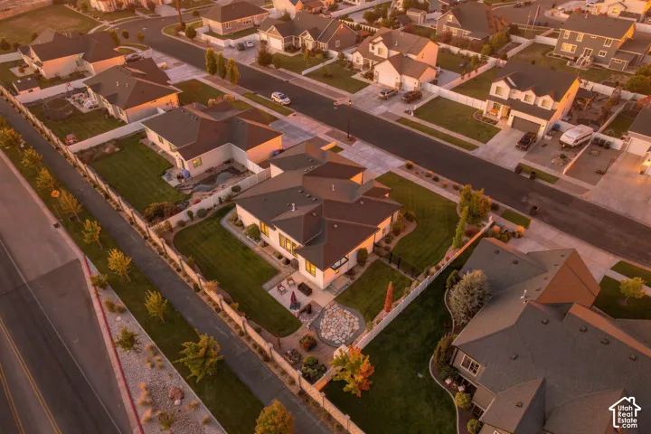 Expansive residential setting with multiple single-family homes, featuring paved streets and sidewalks