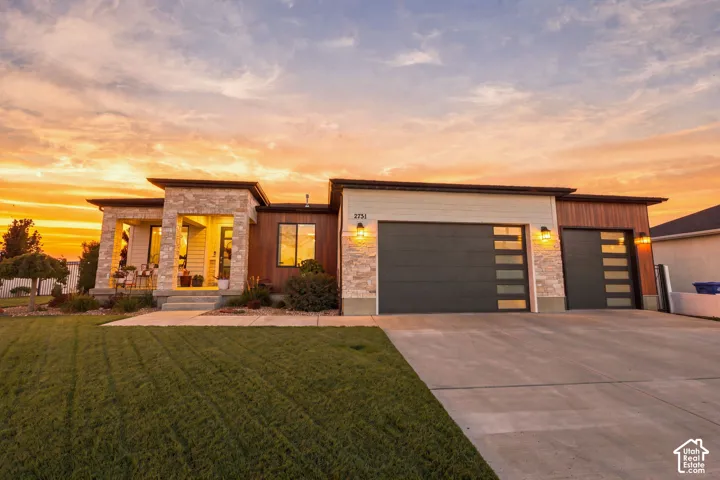 Modern exterior featuring stone and wood-look siding