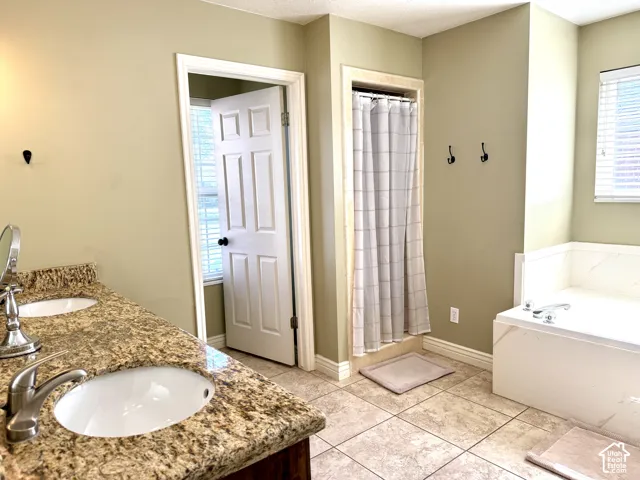 Dual vanity with granite-style countertop and undermount sinks