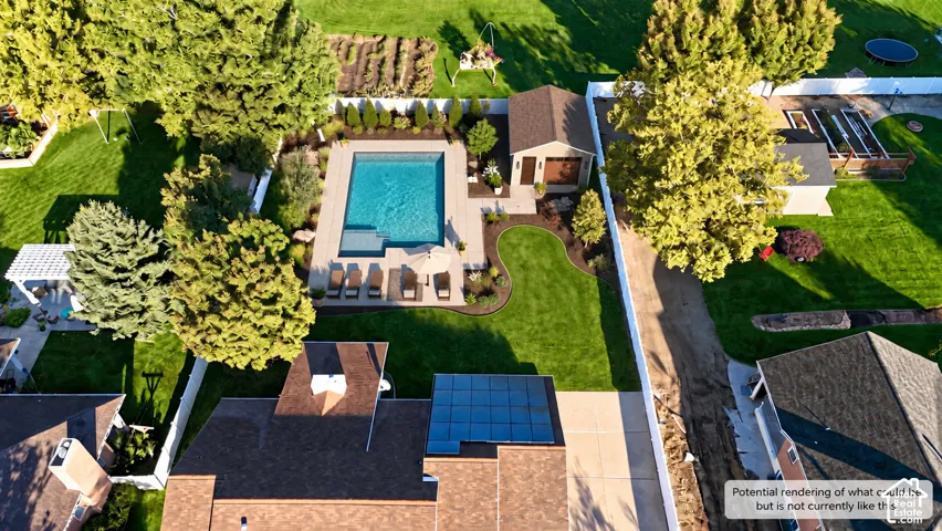 Expansive backyard featuring a rectangular swimming pool, concrete patio, detached pool house, manicured lawn, and mature trees