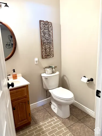 Built-in wood-finish vanity with a white countertop and basin sink