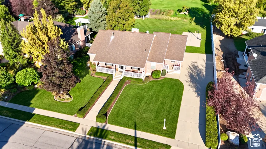 Expansive front lawn with manicured landscaping