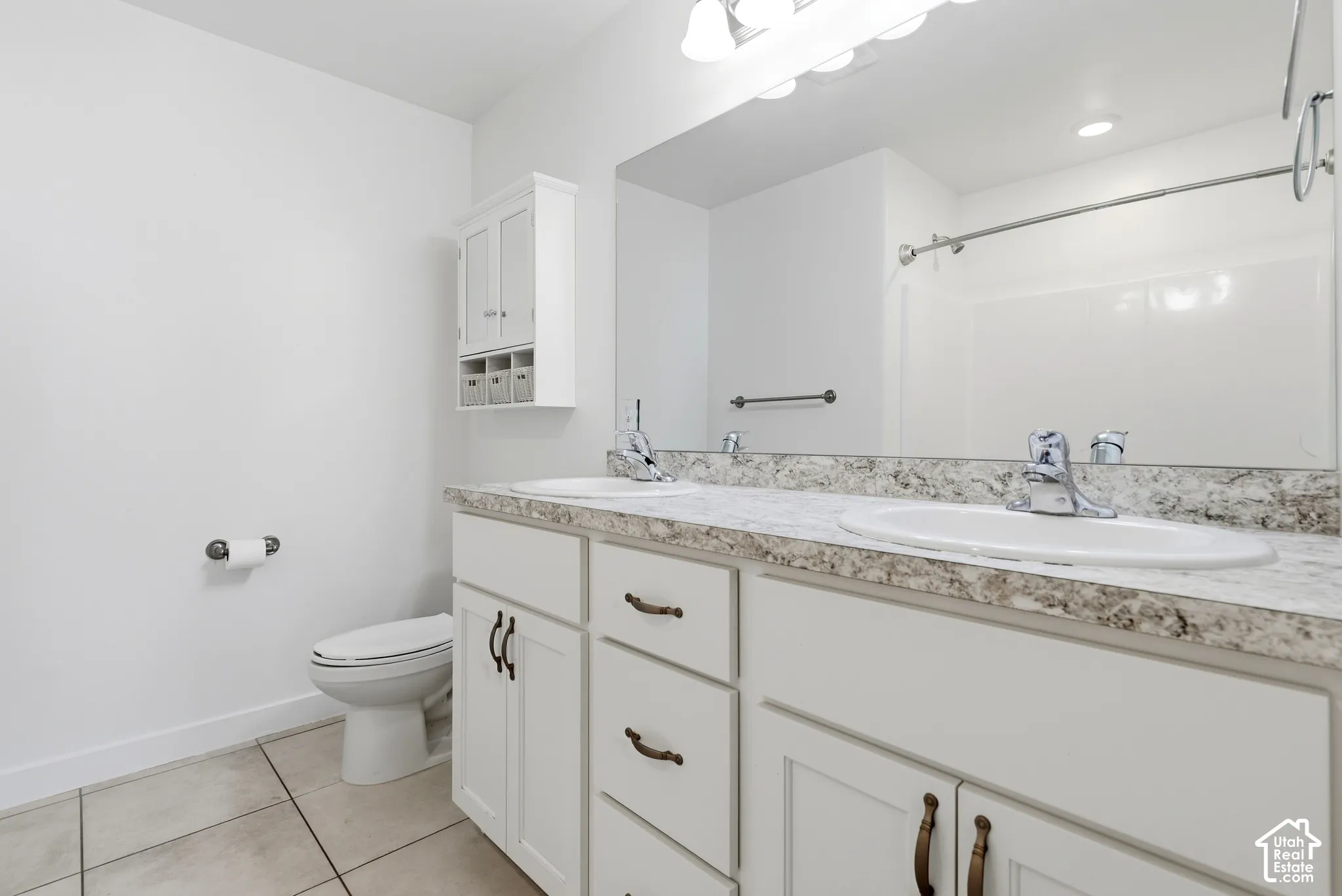 Dual vanity with undermount sinks and laminate countertops