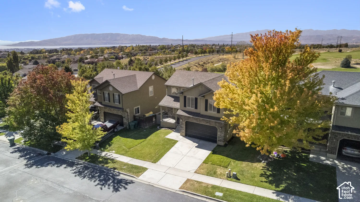 Two-story residence with a stone and stucco exterior