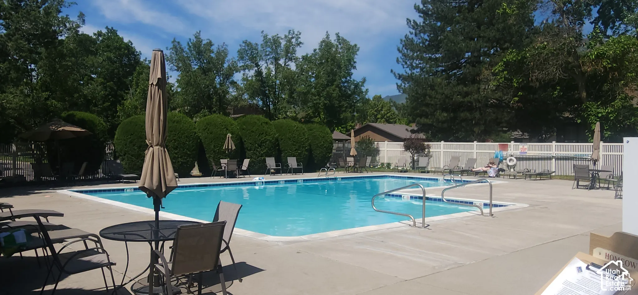Expansive outdoor swimming pool with integrated spa