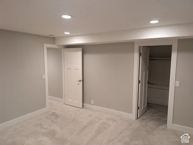 Neutral-toned walls with recessed lighting