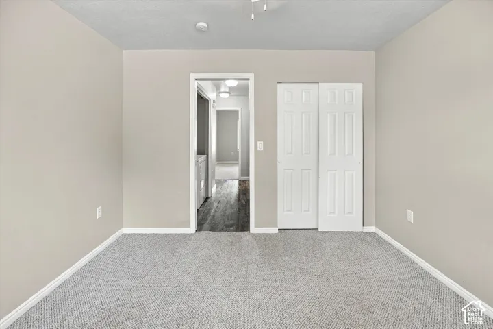 Wall-to-wall carpeting and neutral wall tones