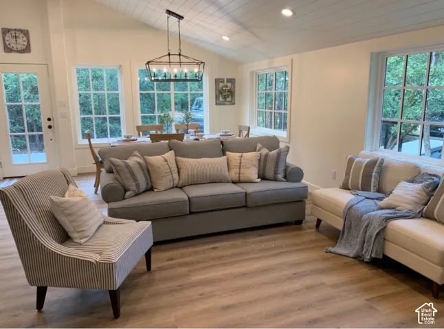 Vaulted ceiling with recessed lighting and shiplap finish