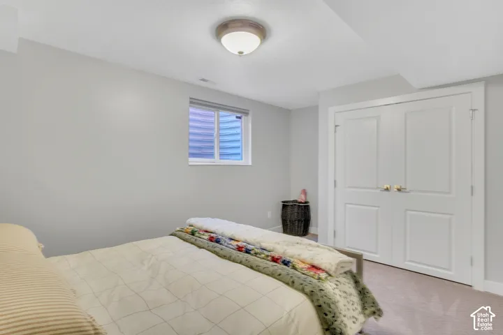 Recessed window with blinds, white trim, and light gray wall paint