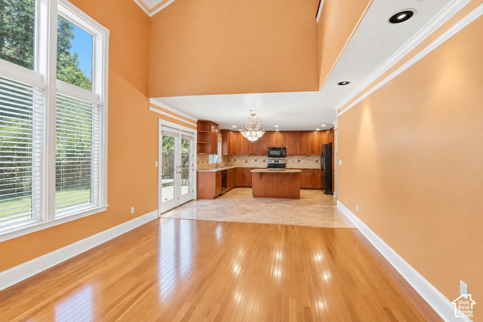 Hardwood flooring and vaulted ceilings create an open atmosphere