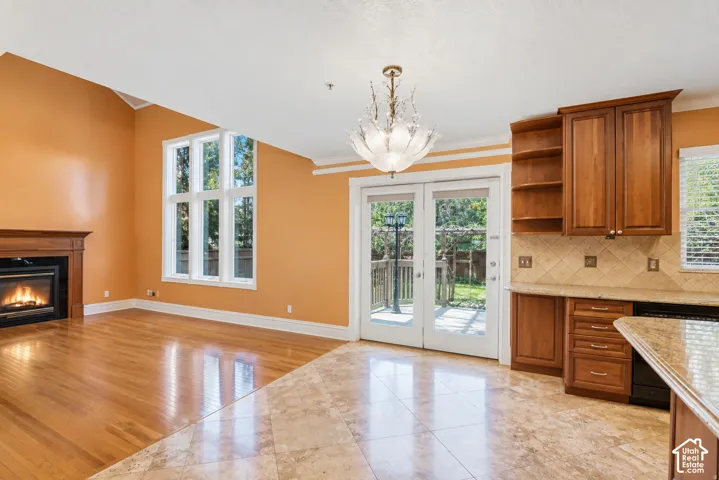 Great room and the second dining area emptied of the current furnishings