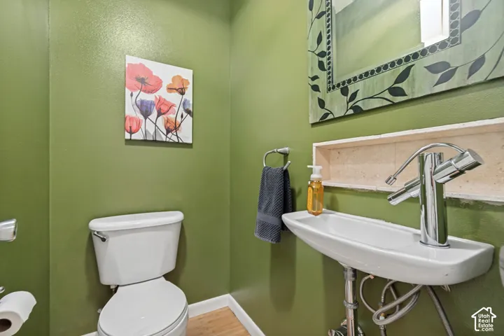 Wall-mounted ceramic sink with chrome faucet