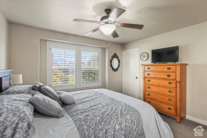 Window with white plantation shutters and trim