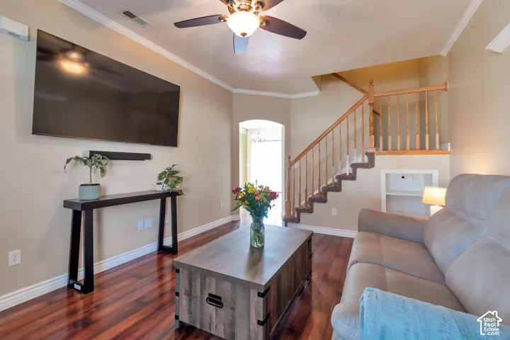 Rich wood-finish flooring with crisp white baseboards