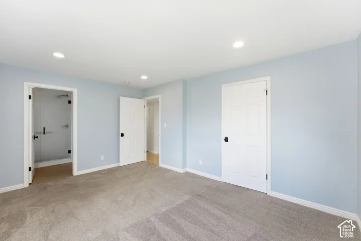 Neutral-toned carpeting complements light blue walls