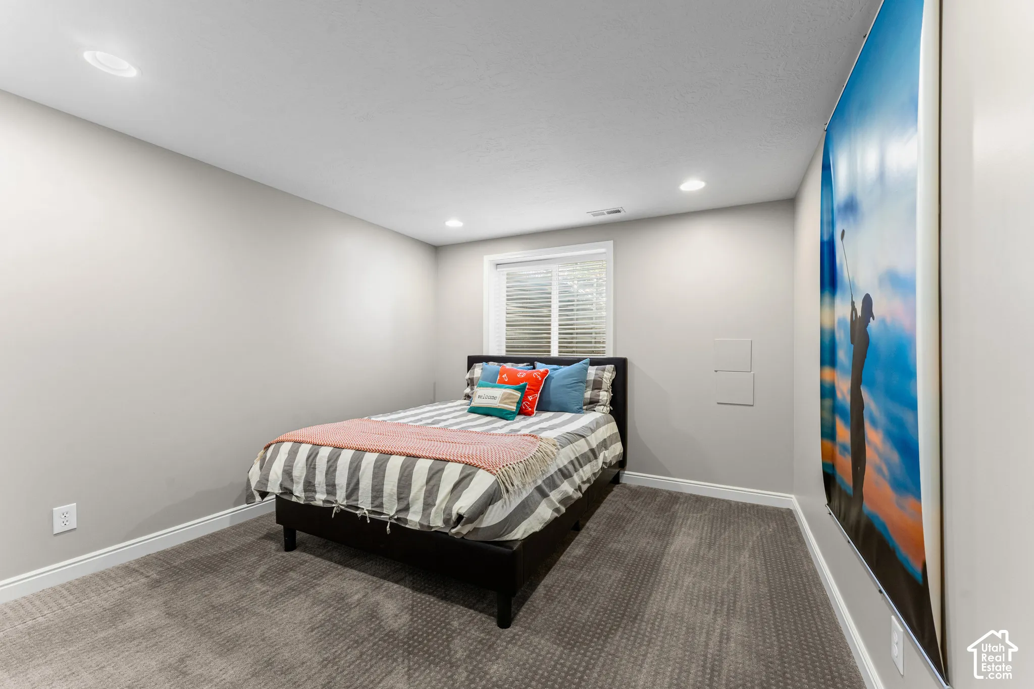 Recessed ceiling lighting, window with blinds, light gray wall paint, and gray carpeted flooring