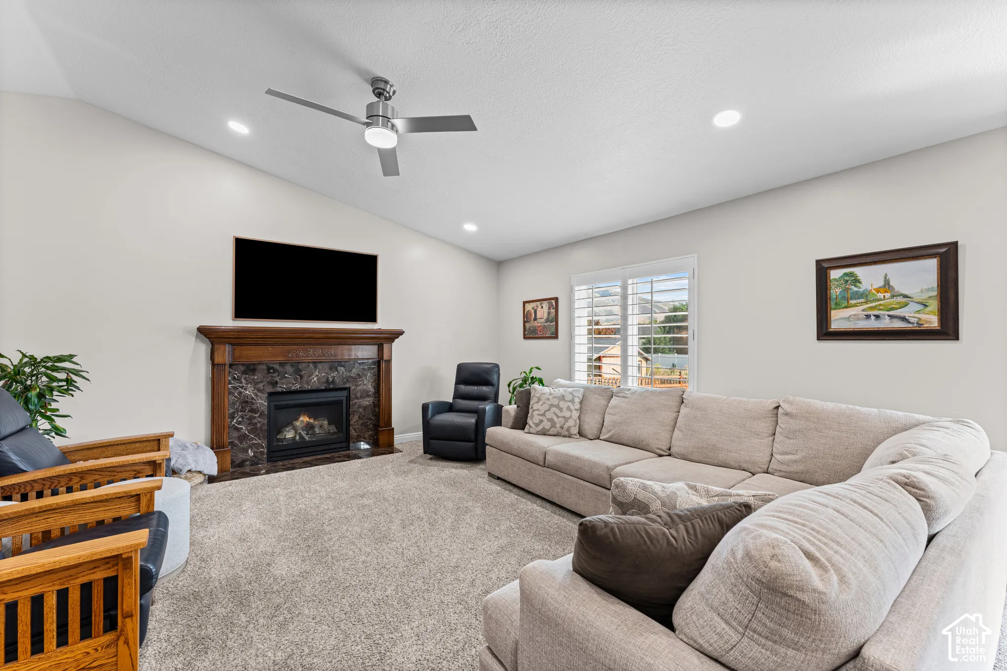 Vaulted ceiling featuring recessed lighting and a ceiling fan