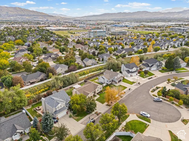 Residential neighborhood with established landscaping and mountain backdrop