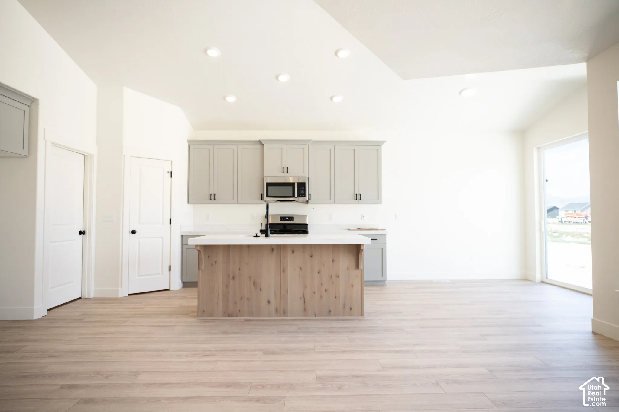 Open dining area adjacent to kitchen with 8' sliding glass door.