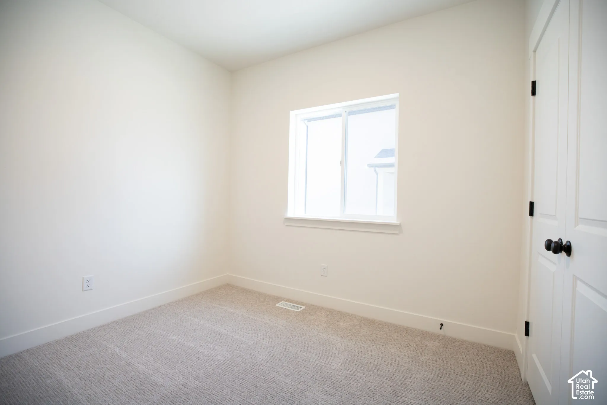 Bedroom #2 with vaulted ceiling and large closet.