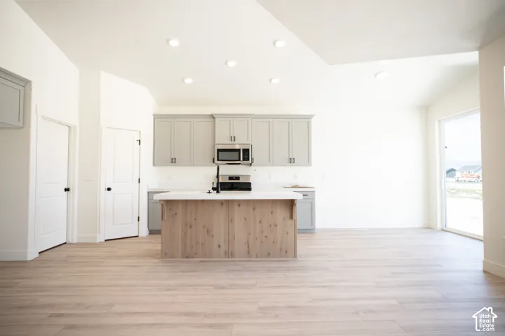 Open dining area adjacent to kitchen with 8' sliding glass door.