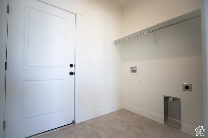 Full-size, dedicated laundry room adjacent to kitchen.