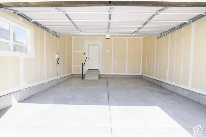Two-car garage with taped finish.