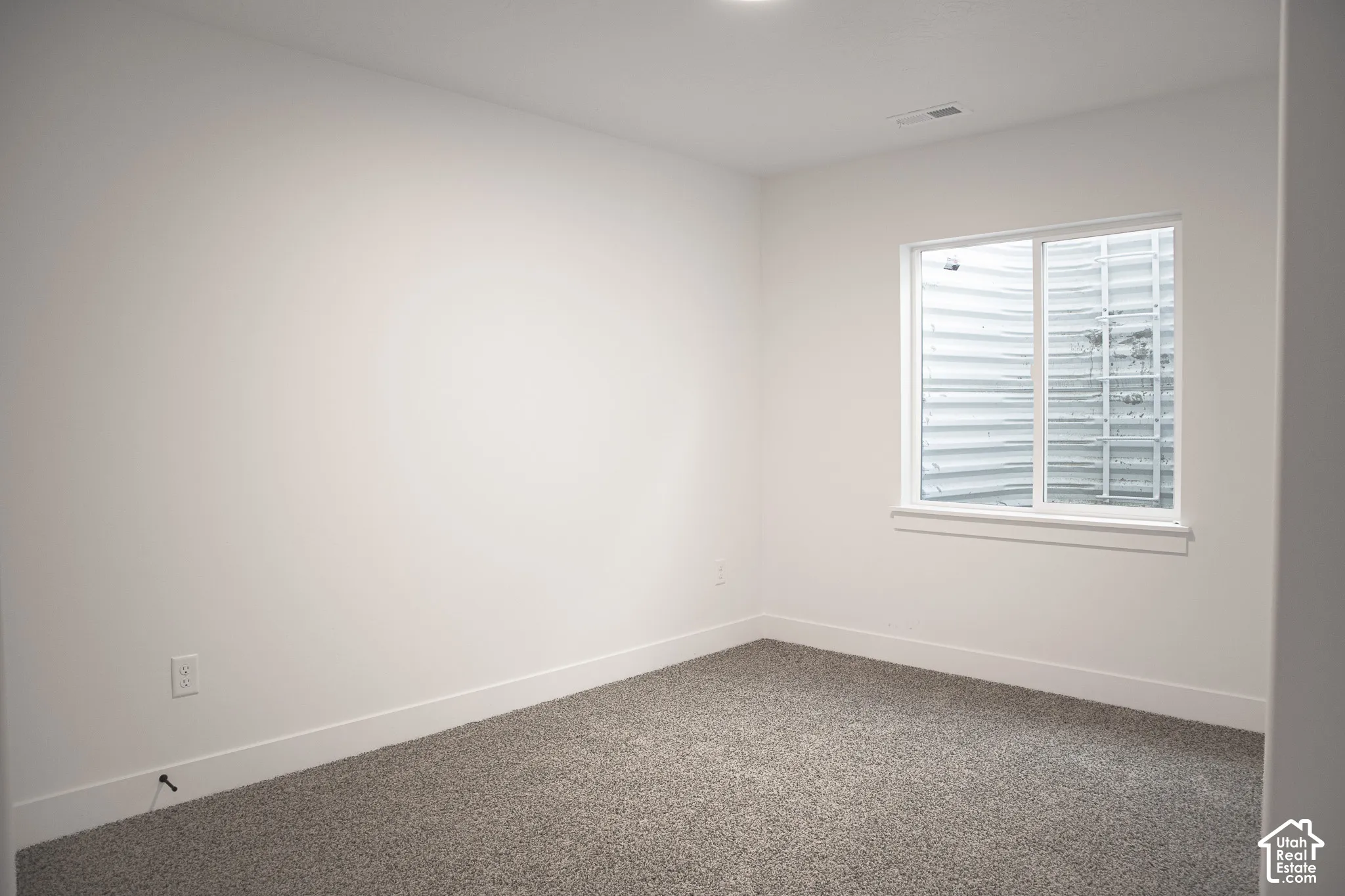 Bedroom #3 with large closet in fully-finished basement.