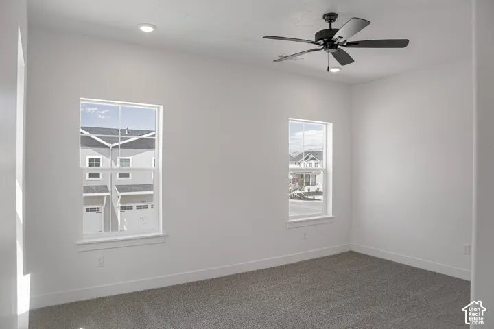 Primary bedroom with 9' ceiling and ceiling fan.