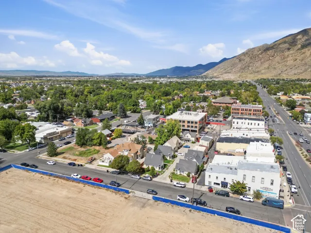 Aerial view of property highlighting Main Street shops adjacent to the east (right)