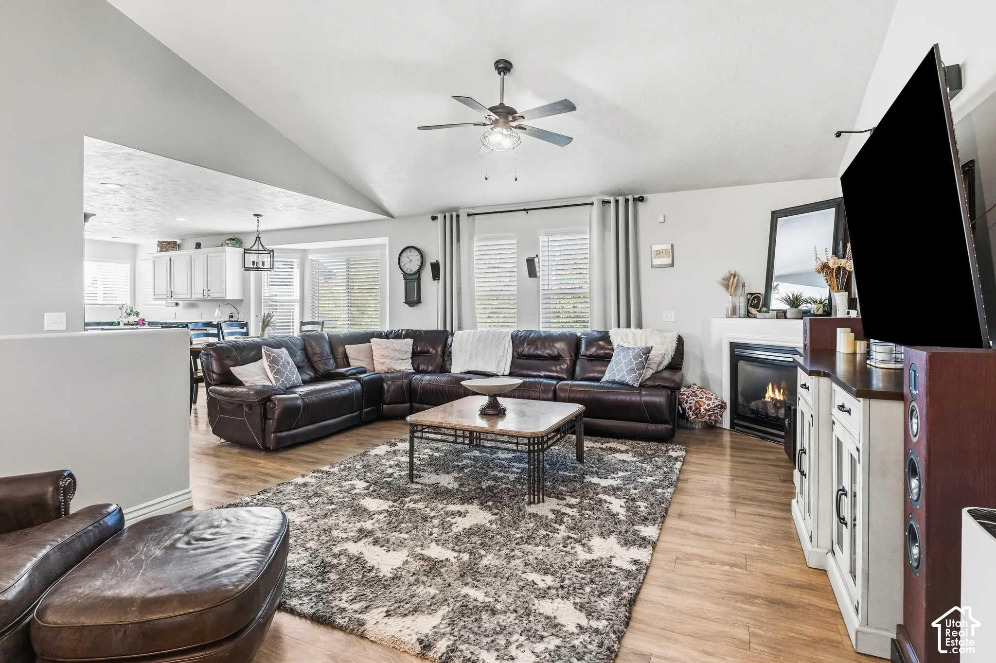 Vaulted ceilings, wood-finish flooring, and a built-in fireplace