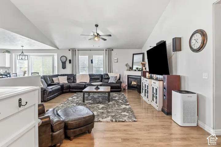 Vaulted ceilings, wood-finish flooring, and a built-in fireplace