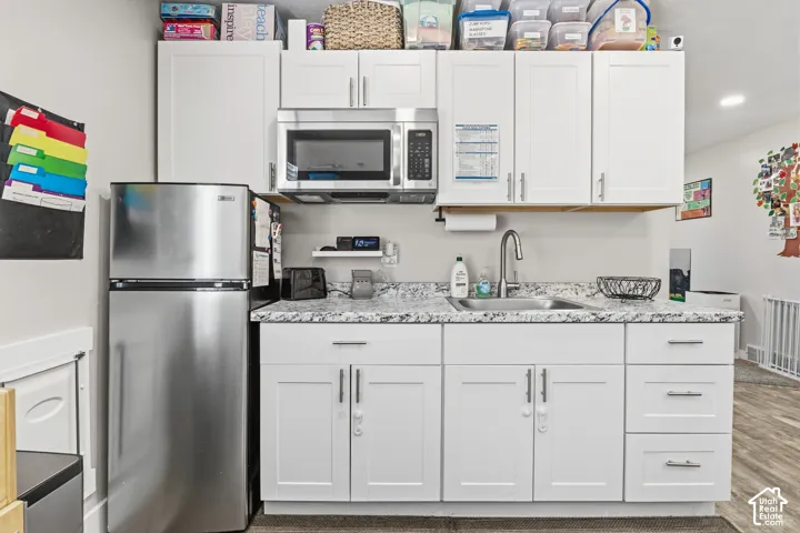 White cabinetry with brushed nickel hardware