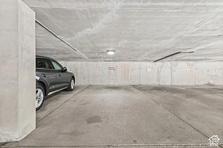 Concrete parking space with overhead lighting