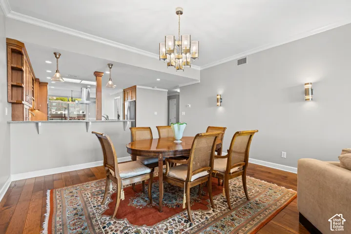 Hardwood flooring, crown molding, and recessed lighting