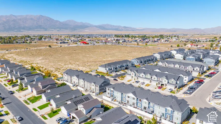 Residential neighborhood featuring a variety of housing styles, including multi-story townhomes and single-family residences