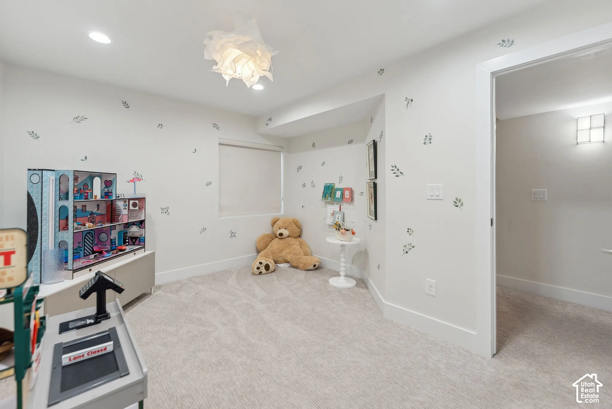 Plush carpeting, recessed lighting, and a modern semi-flush mount light fixture