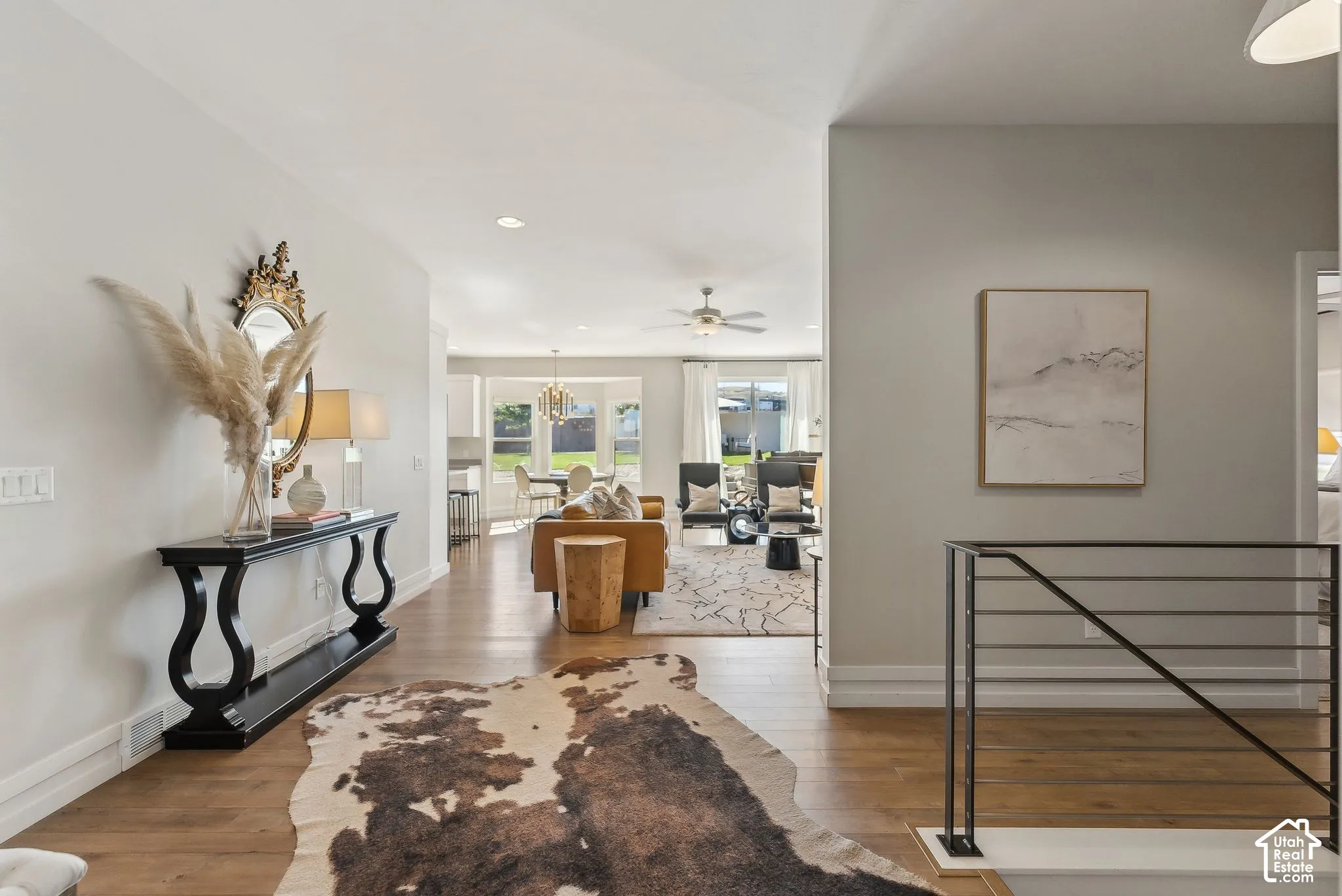 Hardwood-finish flooring, recessed lighting, and a contemporary metal railing