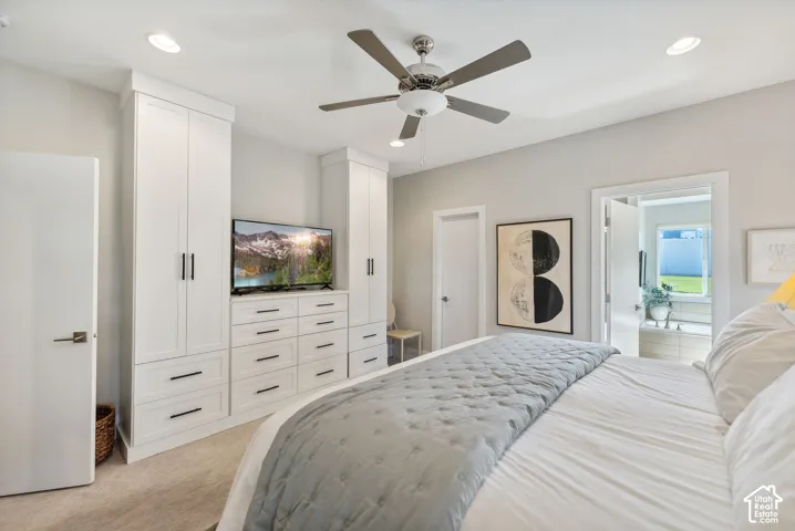 Built-in cabinetry with integrated drawers, flush-mount lighting, and ceiling fan with integrated lighting