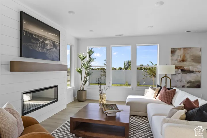 Contemporary fireplace with a linear glass insert and shiplap surround