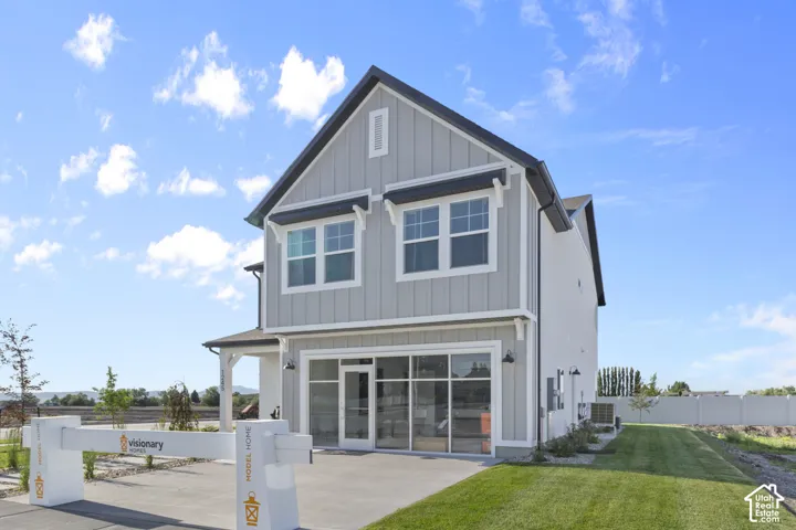 Modern farmhouse exterior with vertical siding and contrasting trim