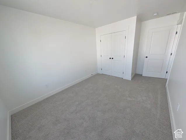 Neutral-toned carpeting throughout