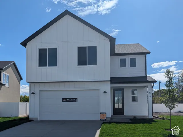 Modern two-story residence with white vertical siding and dark trim