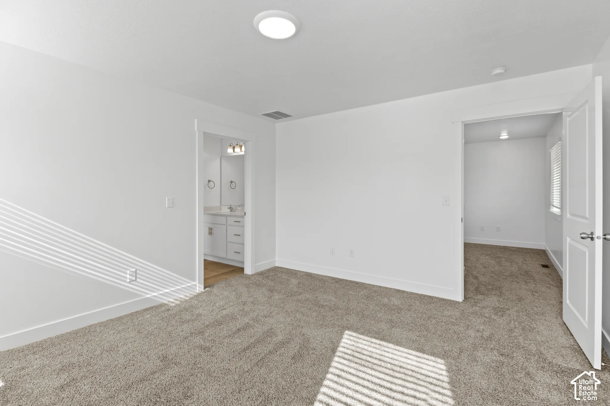 Plush carpeting and crisp white walls