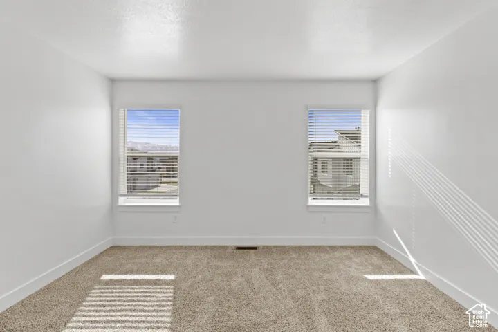 Wall-to-wall carpeting and neutral wall tones