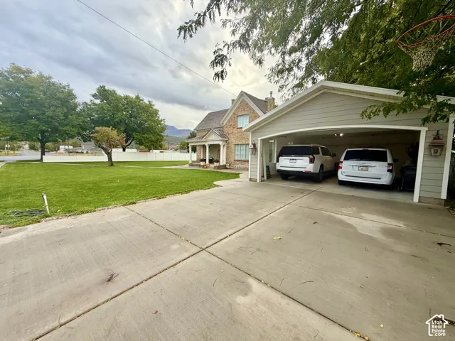 New concrete driveway, and a basketball hoop