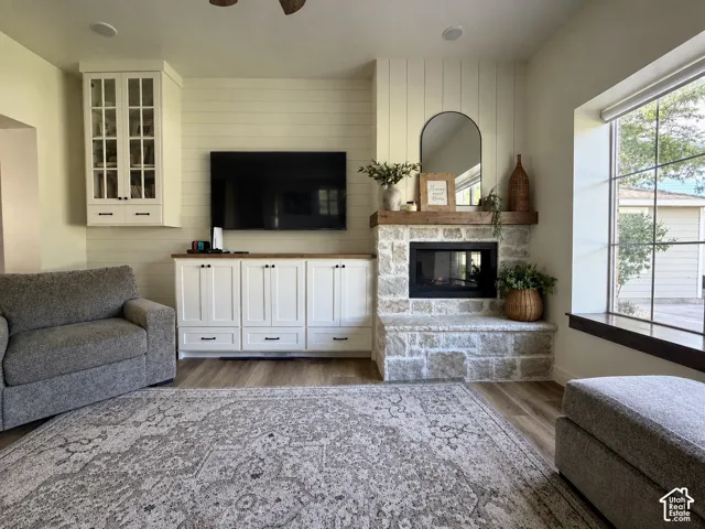 Wood-finish flooring with a shiplap accent wall