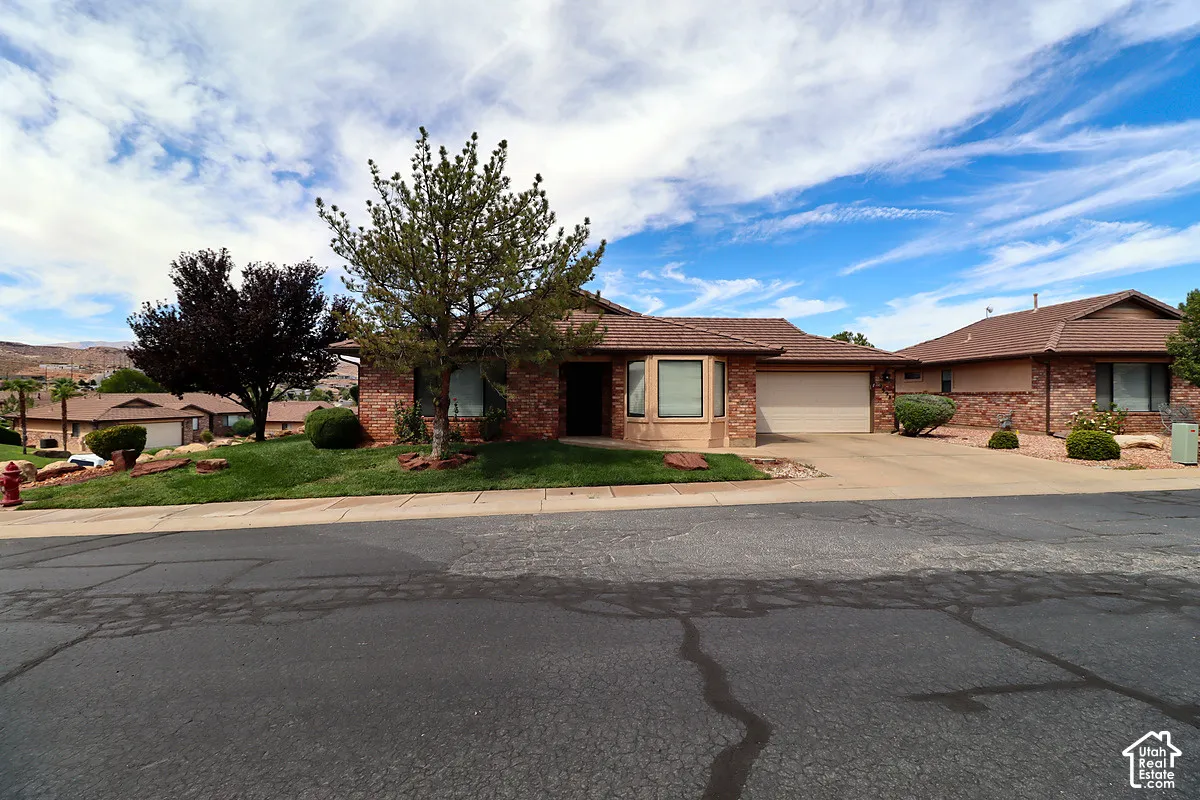 Brick and stucco exterior with multiple windows