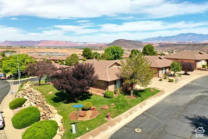 Residential properties featuring tiled roofs and brick exteriors