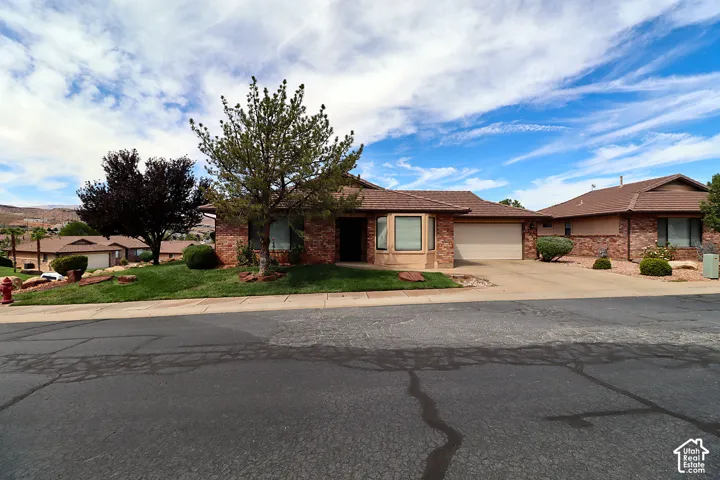 Brick and stucco exterior with multiple windows